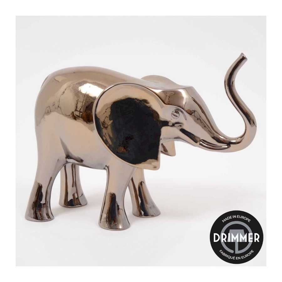 INTERIEUR-DECORATION|EVASION éléphant or 45cmDRIMMERStatues FunnyEVASION éléphant or 45cm Éléphant décoratif EVASION or 45 cm, sculpture design au style élégant et contemporain. Véritable objet de décoration haut de gamme, cet éléphant doré apporte une touche de prestige, de raffinement et d’exotisme à votre intérieur. Idéal pour sublimer un salon, une entrée ou une console, il s’intègre parfaitement dans une décoration chic, moderne ou ethnique luxe. &nbsp;